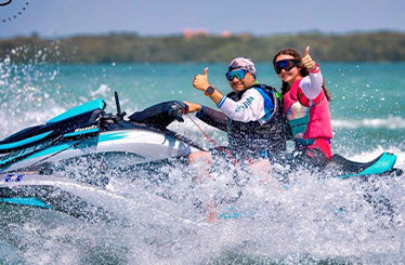 People are having fun riding jet ski