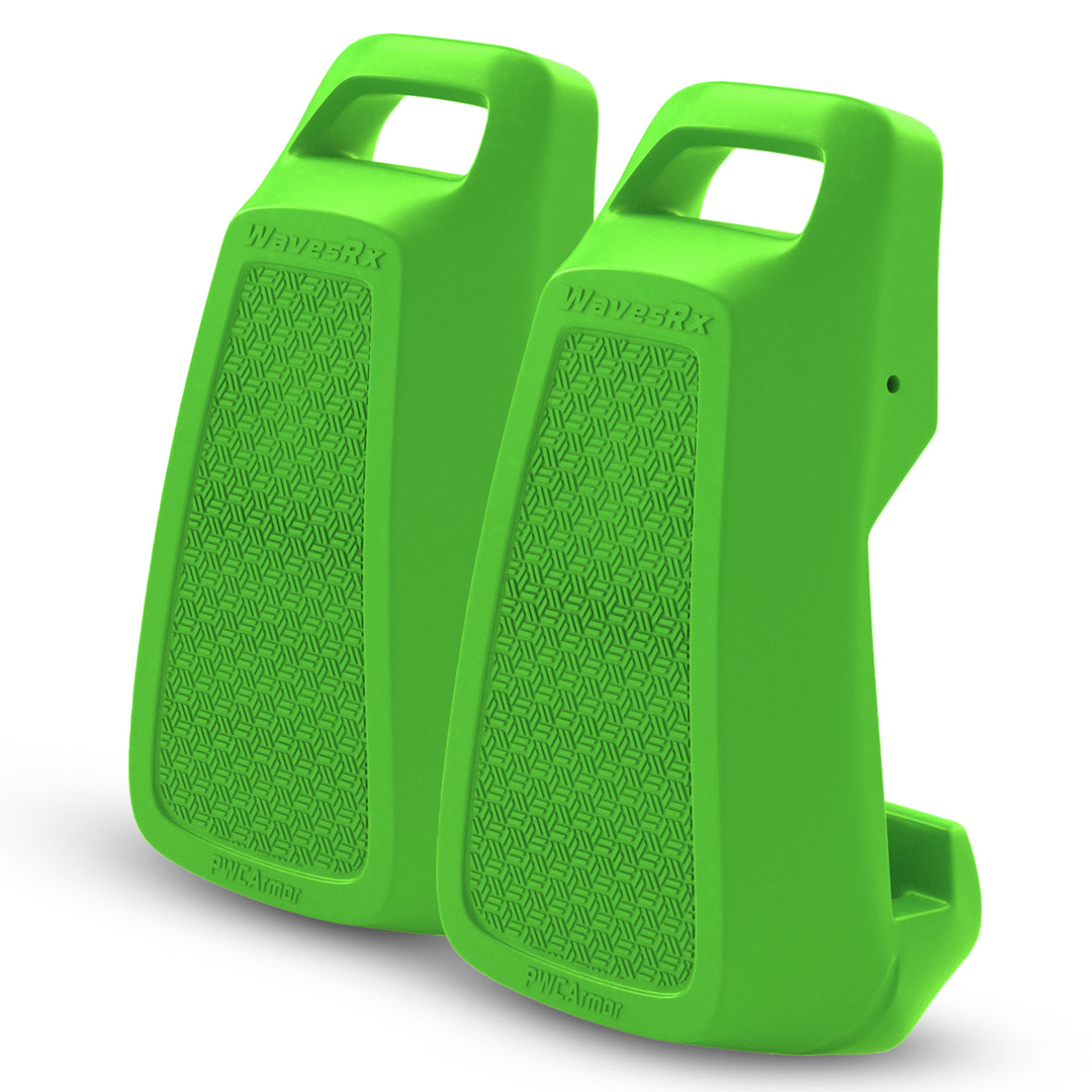 Two green cowbells with textured surfaces on a white background